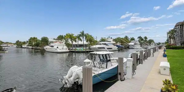 Image 4: Scenic canal views surrounded by luxury homes and