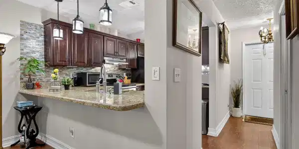 Image 2: Pendants over extented counter for seating and ent