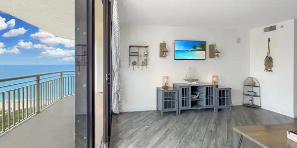 Image 4: Living Room w/ Balcony Access
