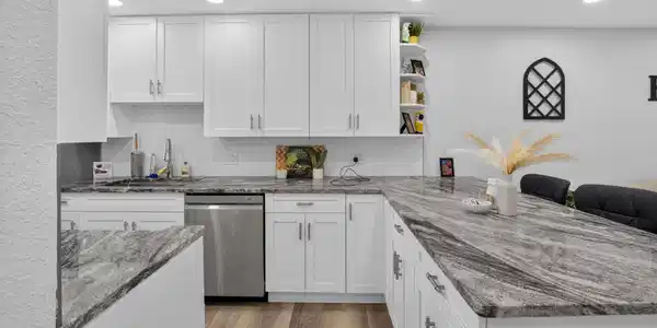 Image 4: Modern kitchen featuring white shaker cabinetry, s