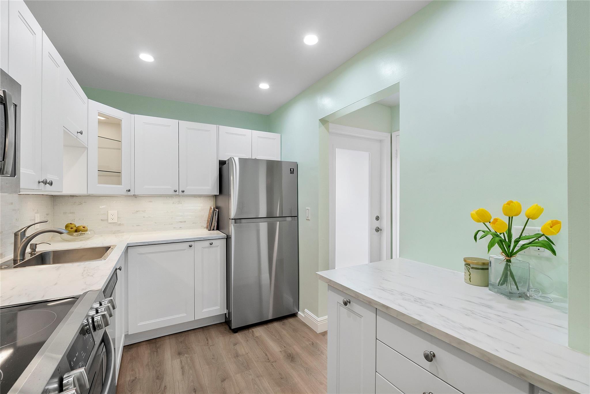 Image 2: View of the Kitchen from the dinning area.