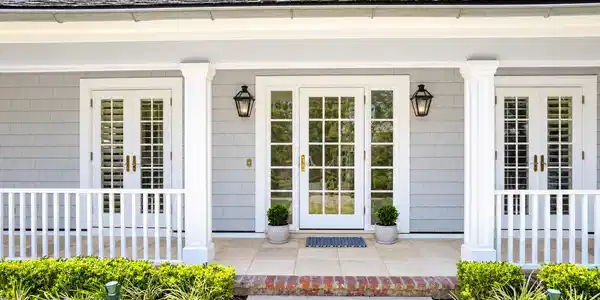 Image 2: Classic French doors complementing the timeless Co