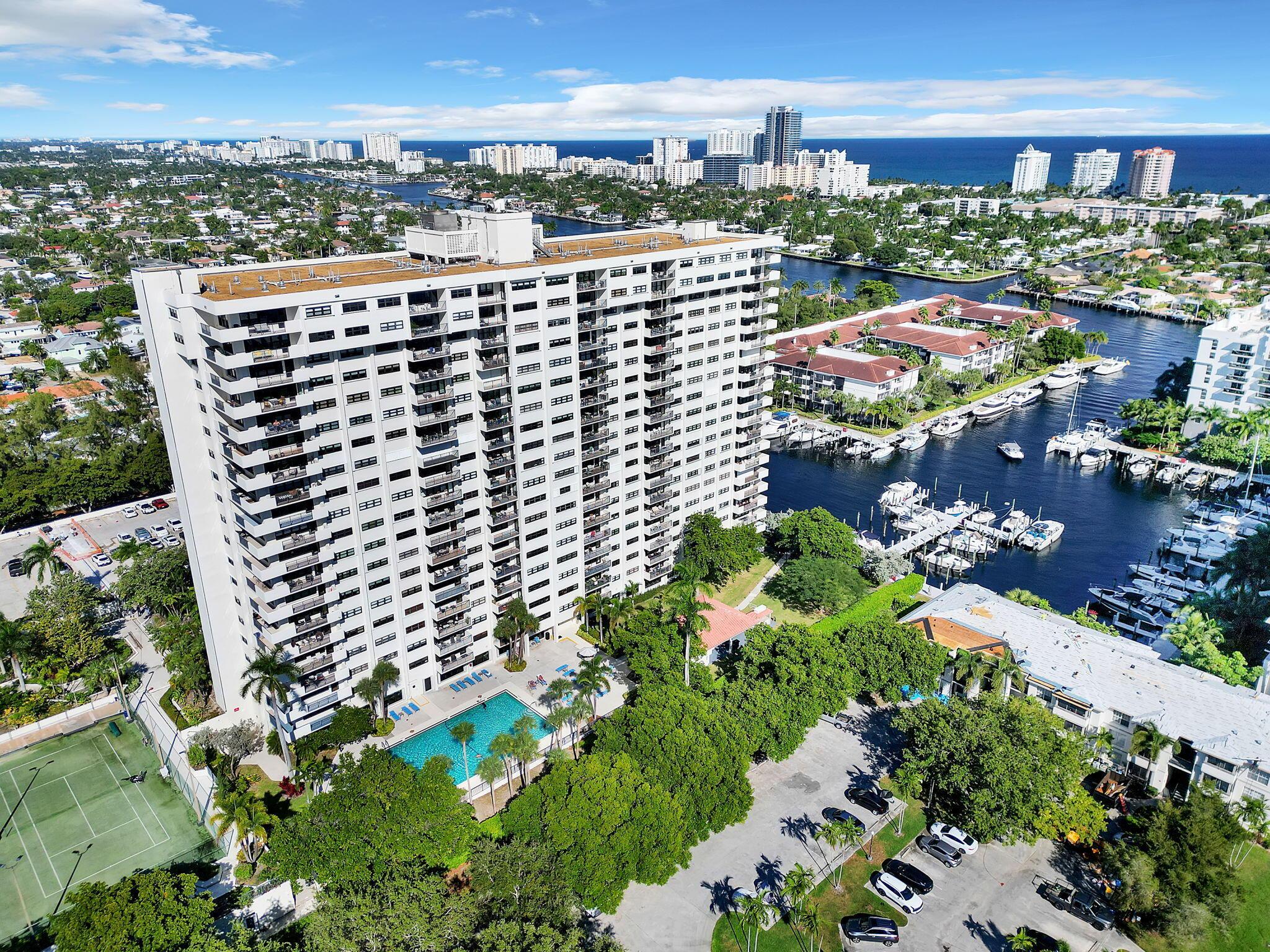 Image 1: Multi-story high-rise residential building featuri