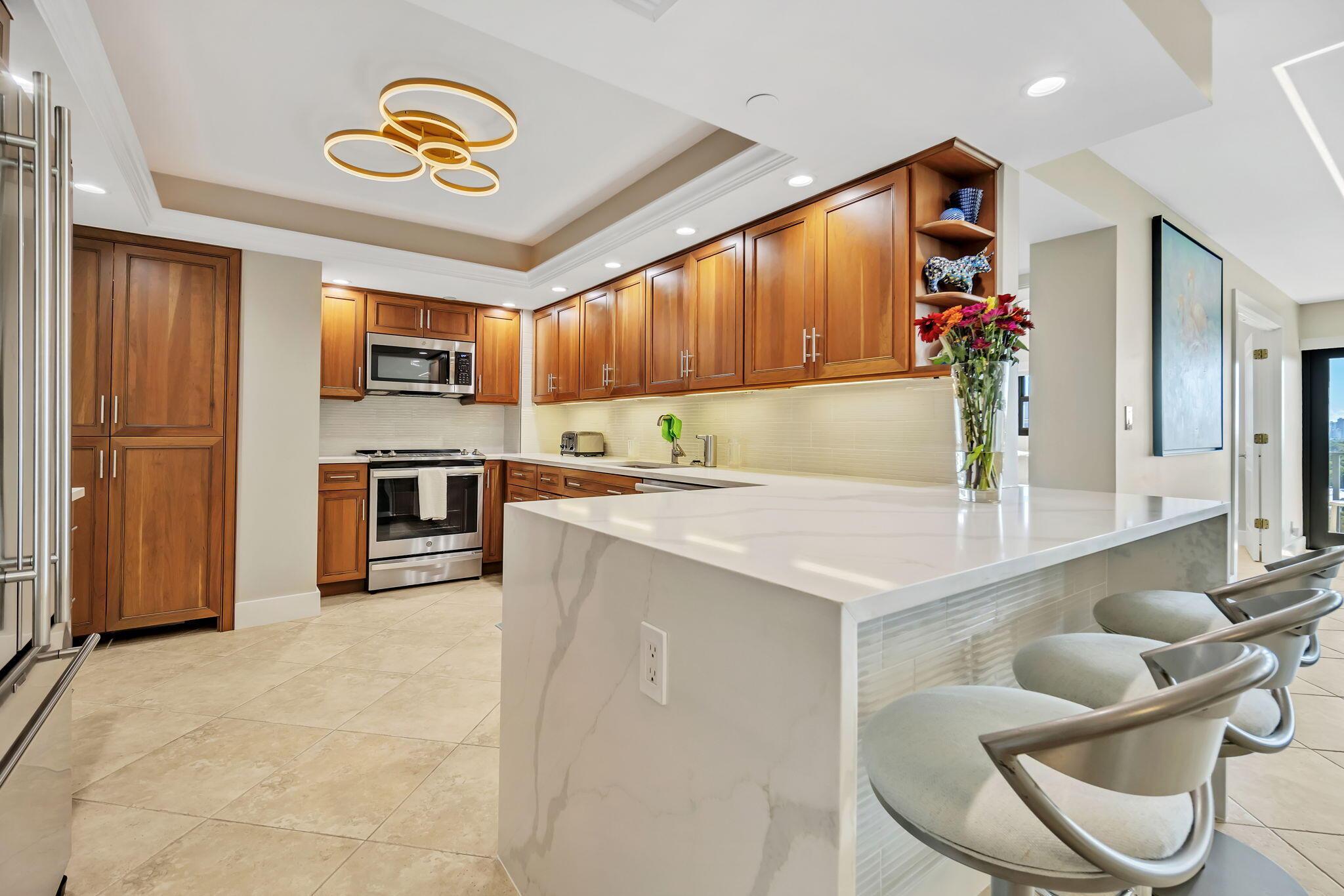 Image 2: upgraded kitchen featuring quartz counter top with