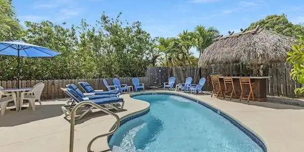 Image 4: Pool area features ultimate privacy with custom ti