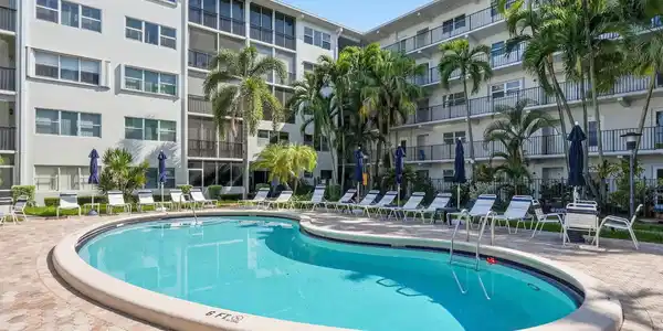 Image 3: Resort-style pool with integrated steps, surrounde
