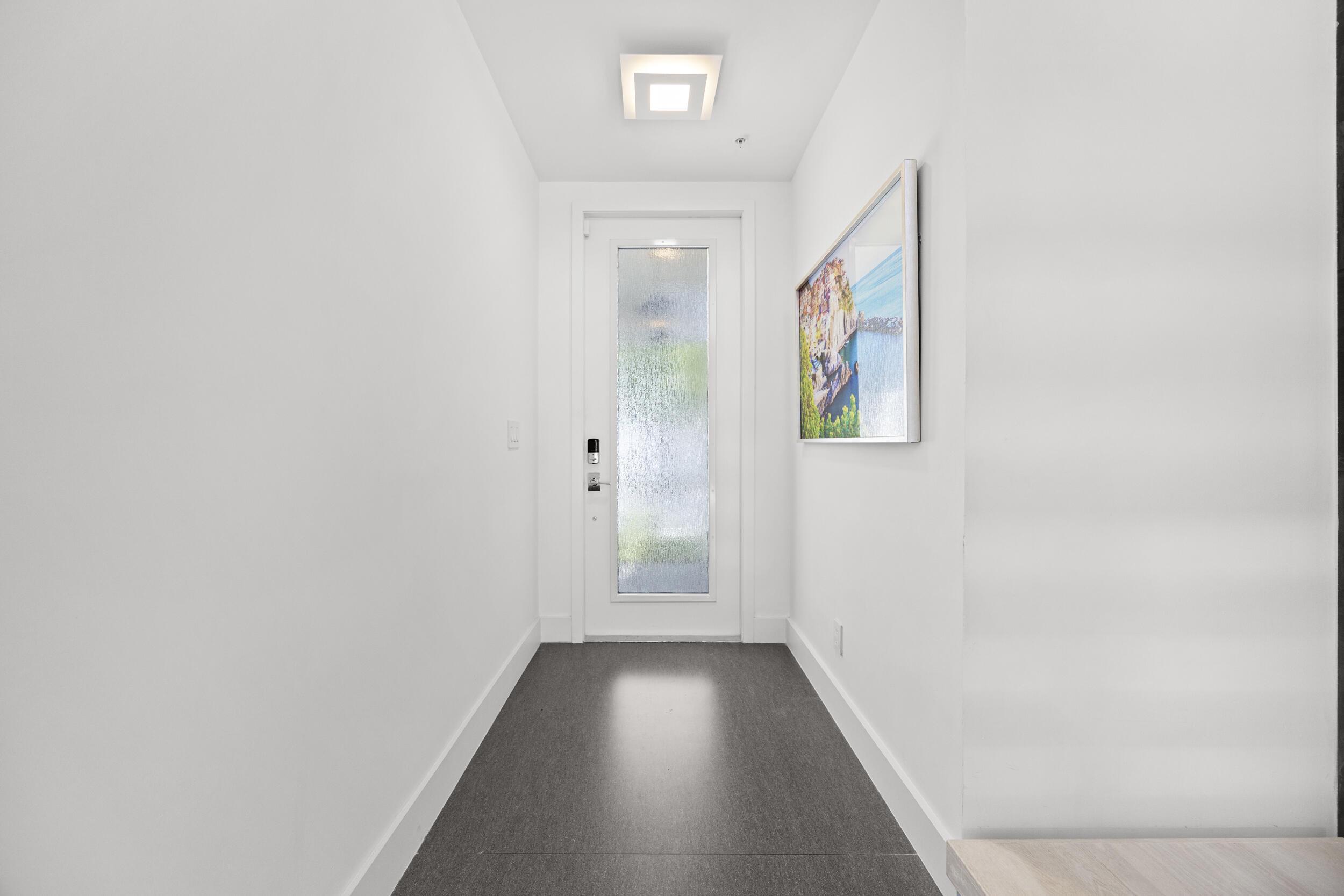 Image 4: Behind this elegant frosted impact glass door lies