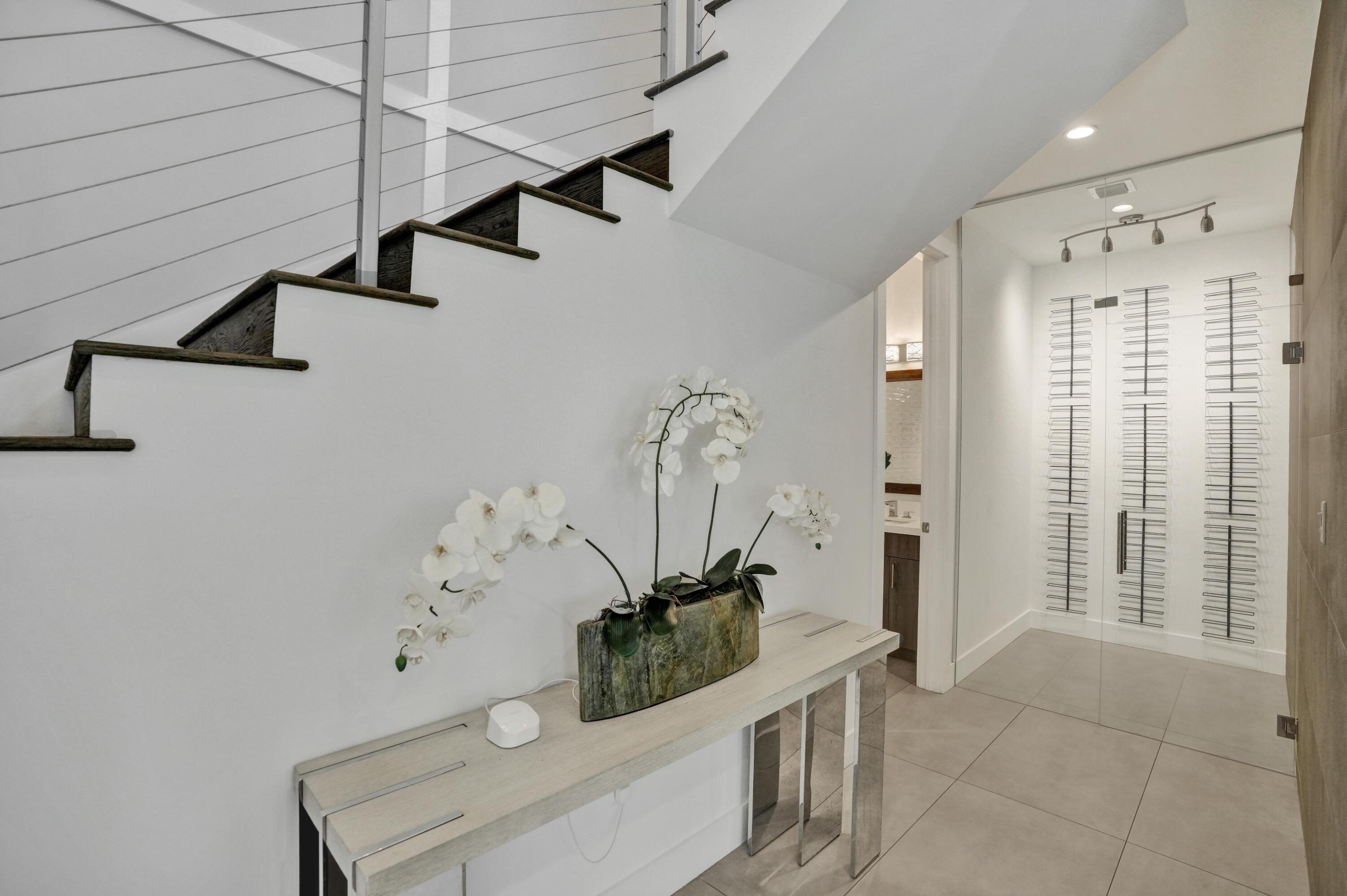 Image 4: Entryway with wine storage.