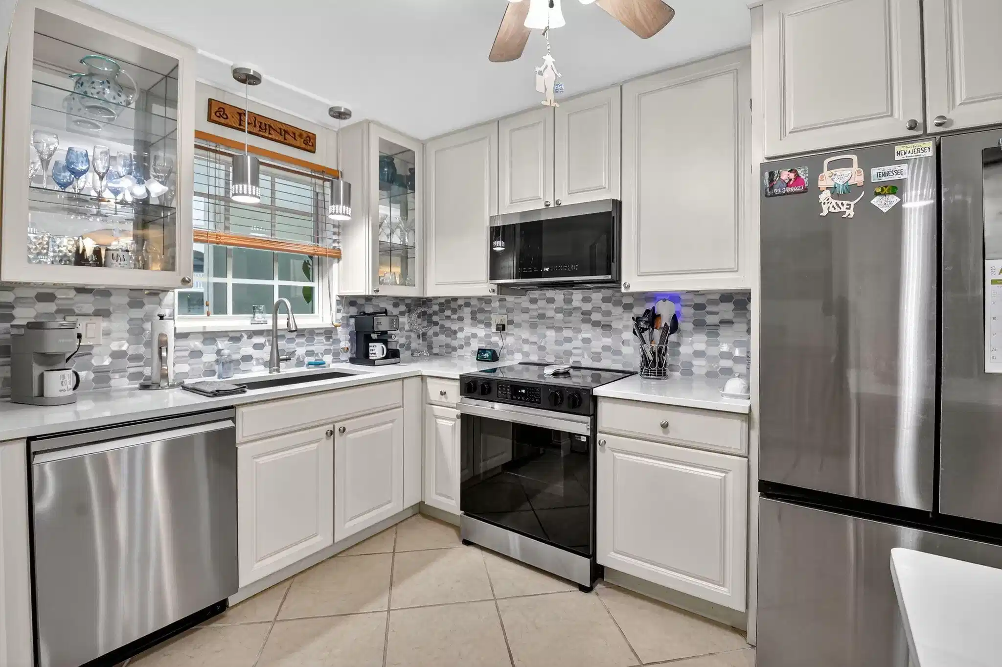 Image 1: Neutral Cabinets and Counters w/stylish backsplash