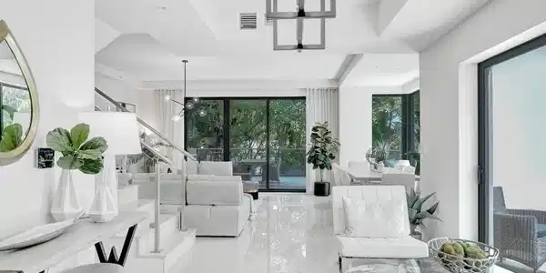 Image 4: Open-concept living area featuring high-gloss floo
