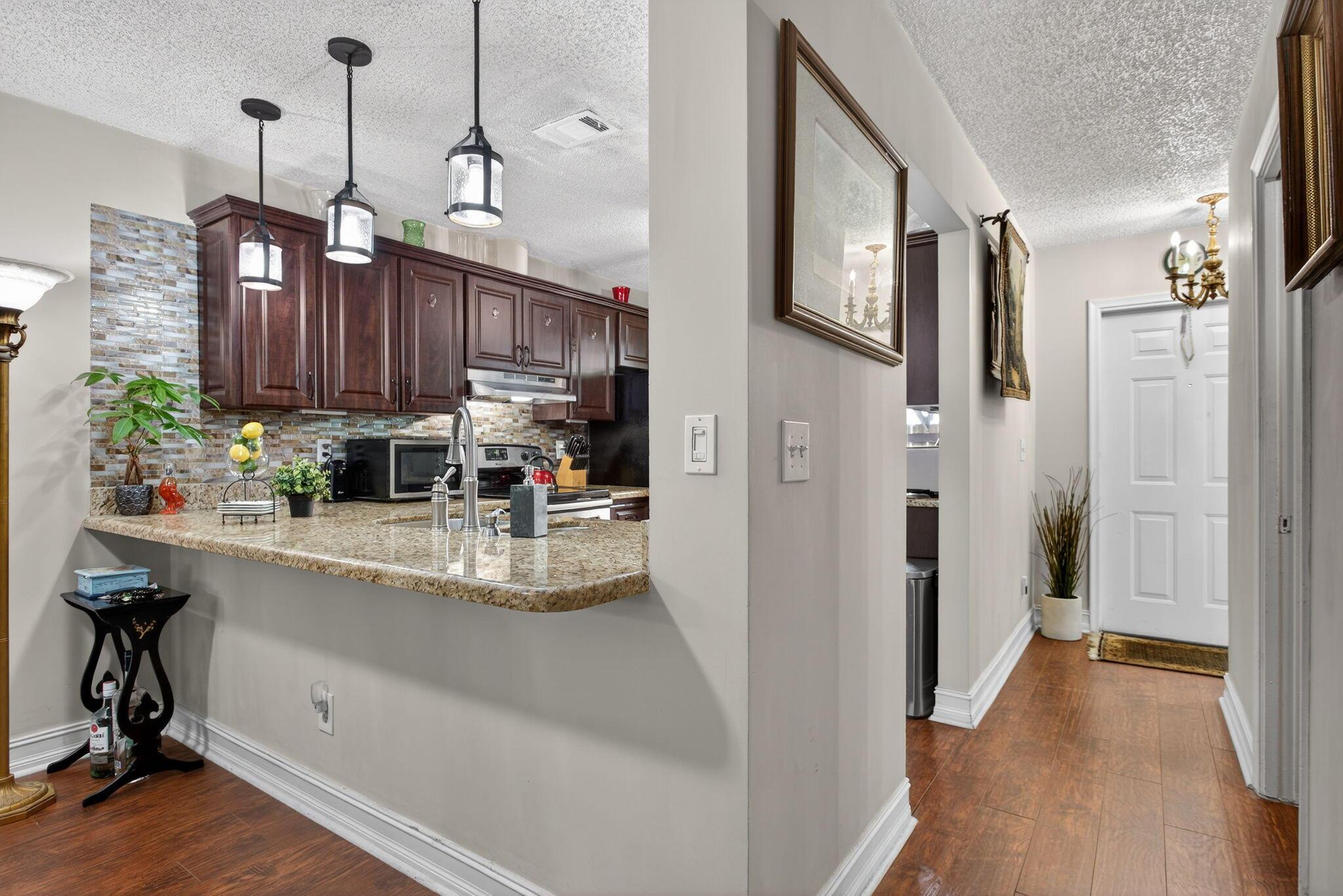 Image 2: Pendants over extented counter for seating and ent