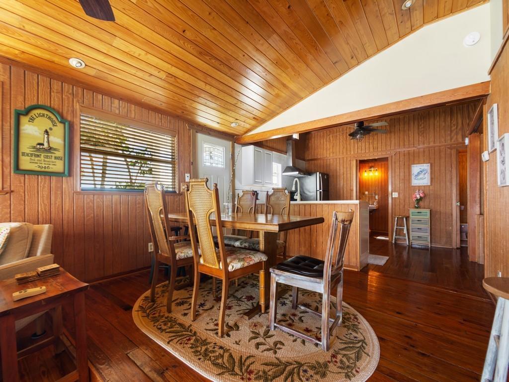 Image 2: Wood-paneled interior featuring a wood ceiling and