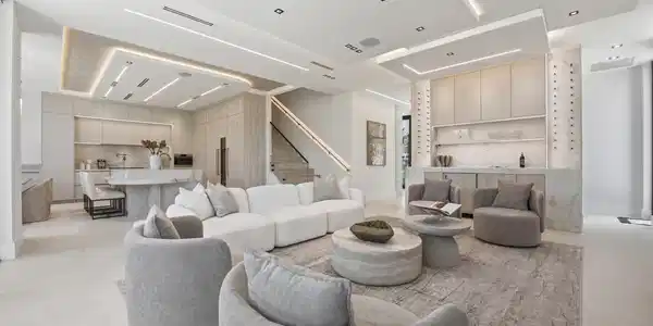 Image 2: Open-concept living space featuring a built-in wet