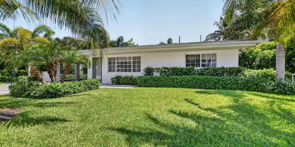 Image 2: This Florida home offers many swaying palm trees t