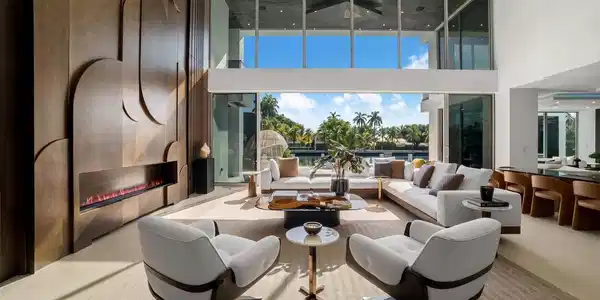 Image 4: Sun-filled waterfront great room featuring floor-t