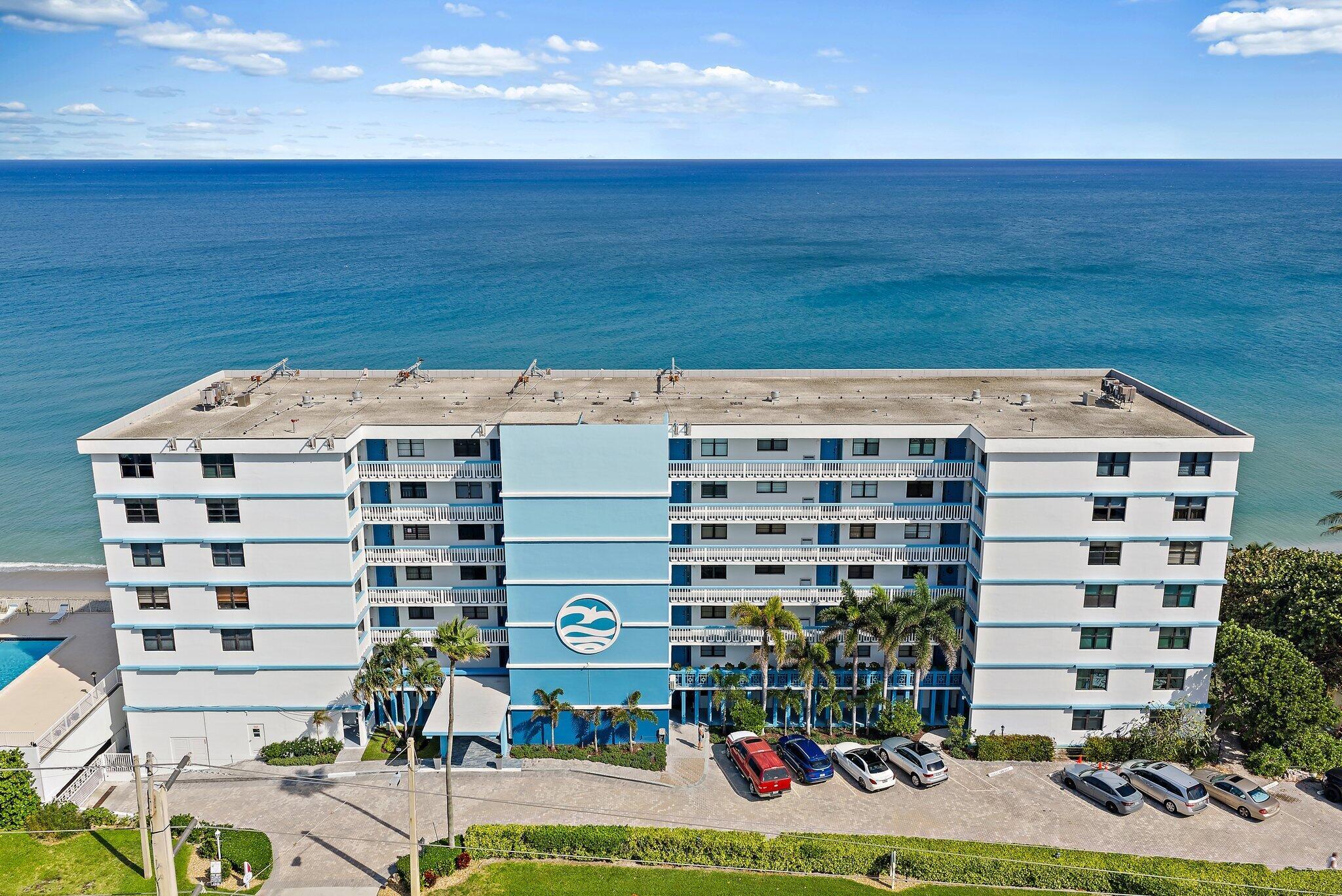 Image 2: Exterior Photo. Directly on the sand.