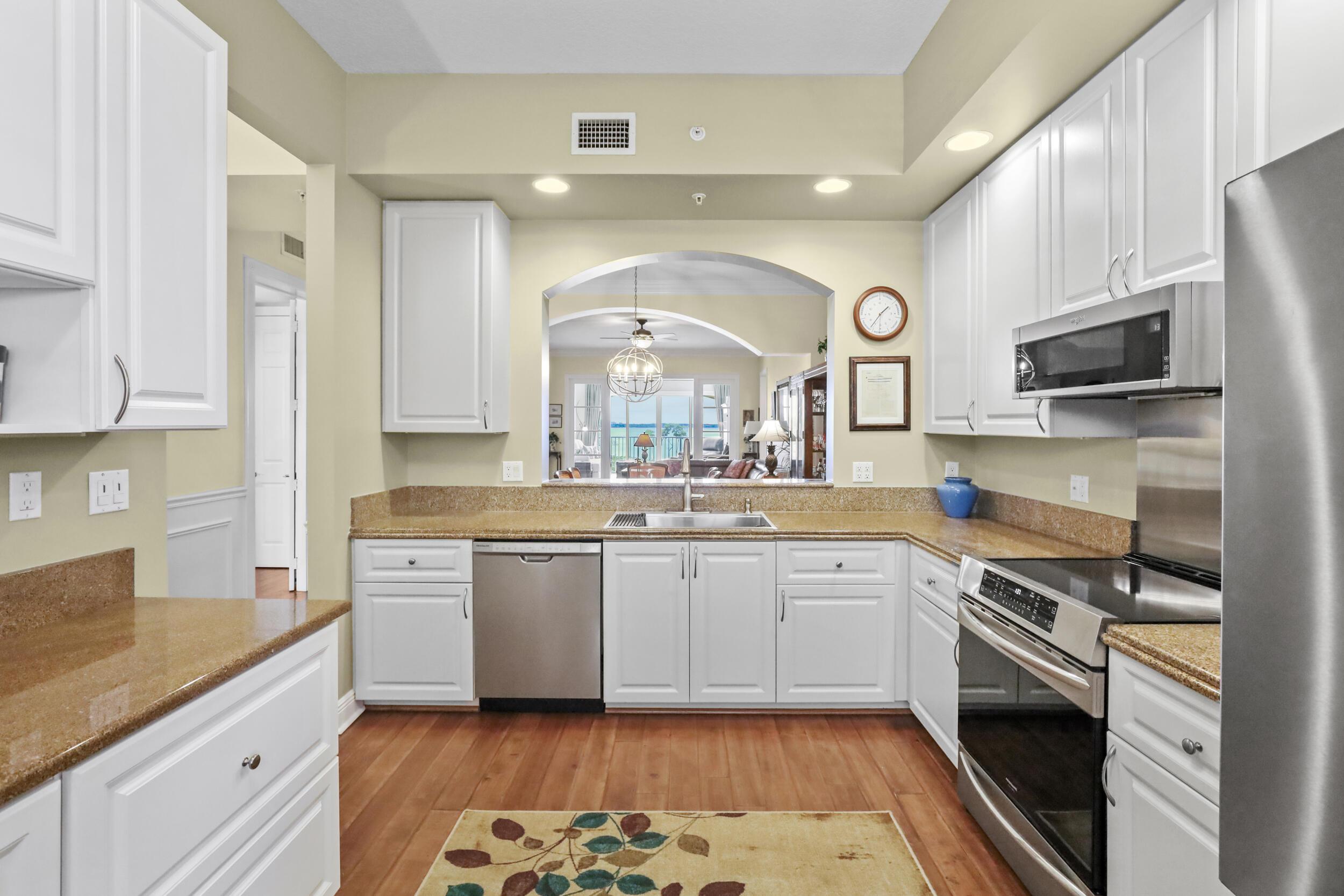 Image 3: Another view of kitchen that opens to dining/livin