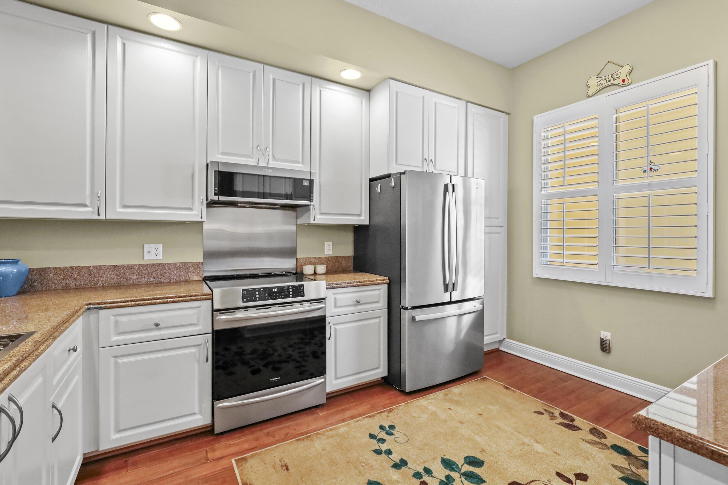 Image 4: Stainless appliances include an induction range, n