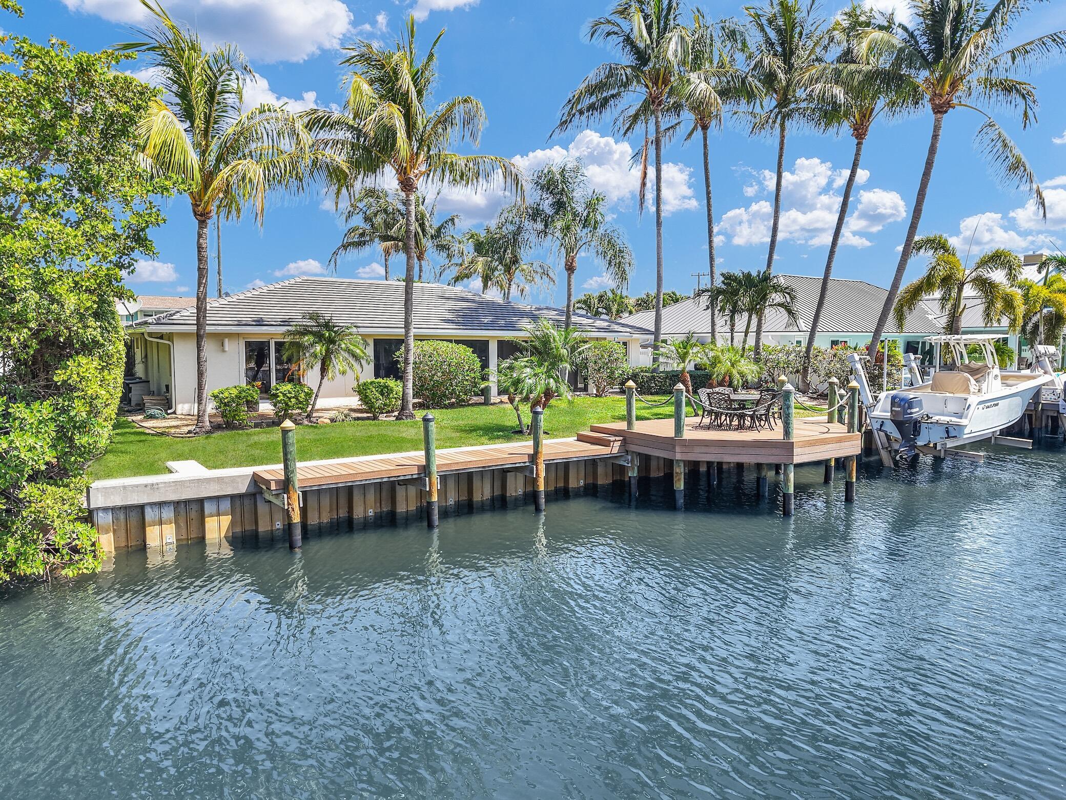 Image 1: You're waterfront home with boat lift!