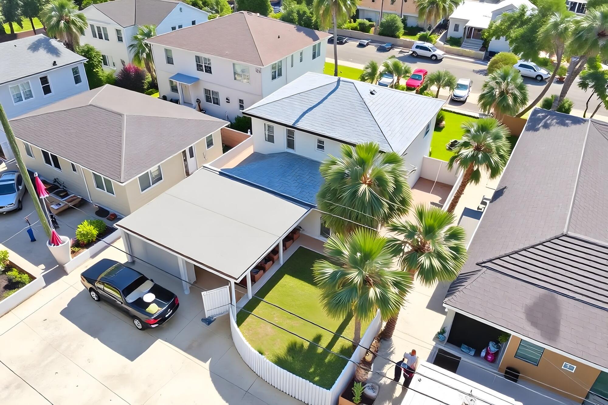 Image 4: Carport & 1-Car Garage. Photo enhanced virtually.