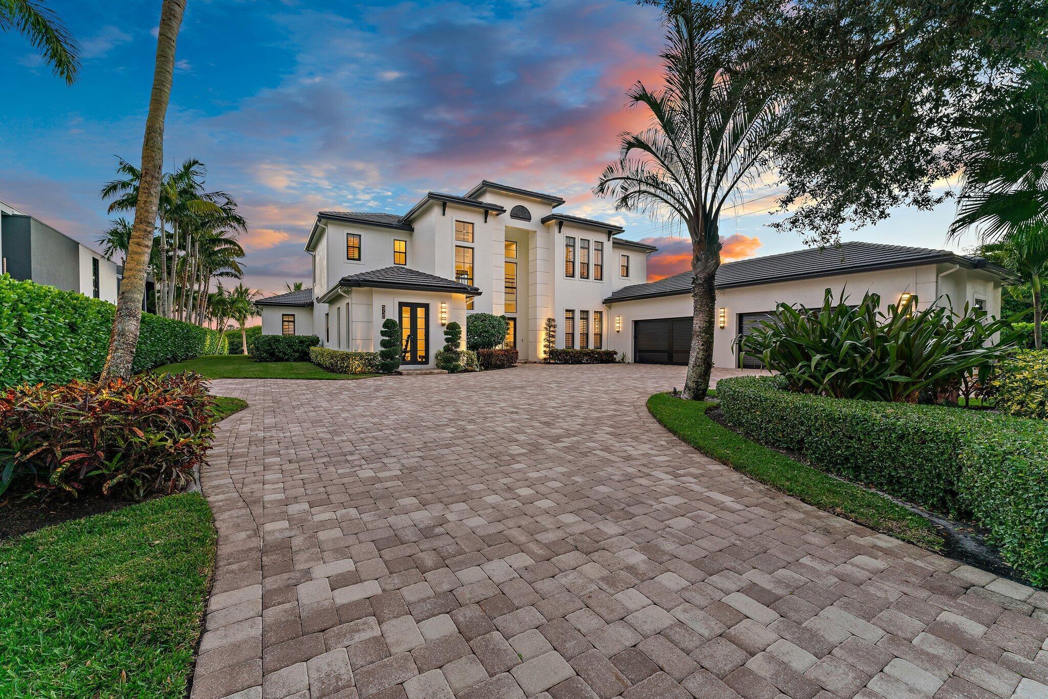 Image 4: grand driveway w/ privacy gate