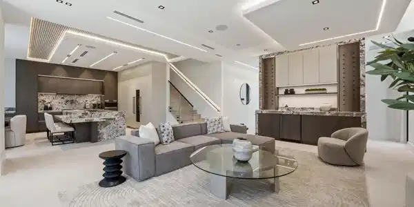 Image 2: Open-concept living area with integrated kitchen,
