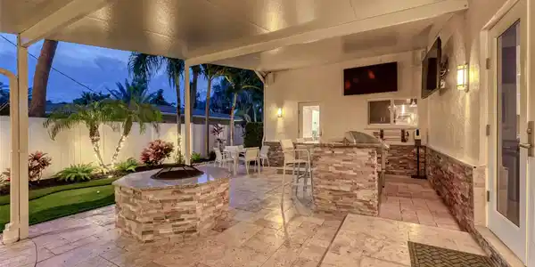 Image 4: Covered Patio with outdoor kitchen, fire pit, heat