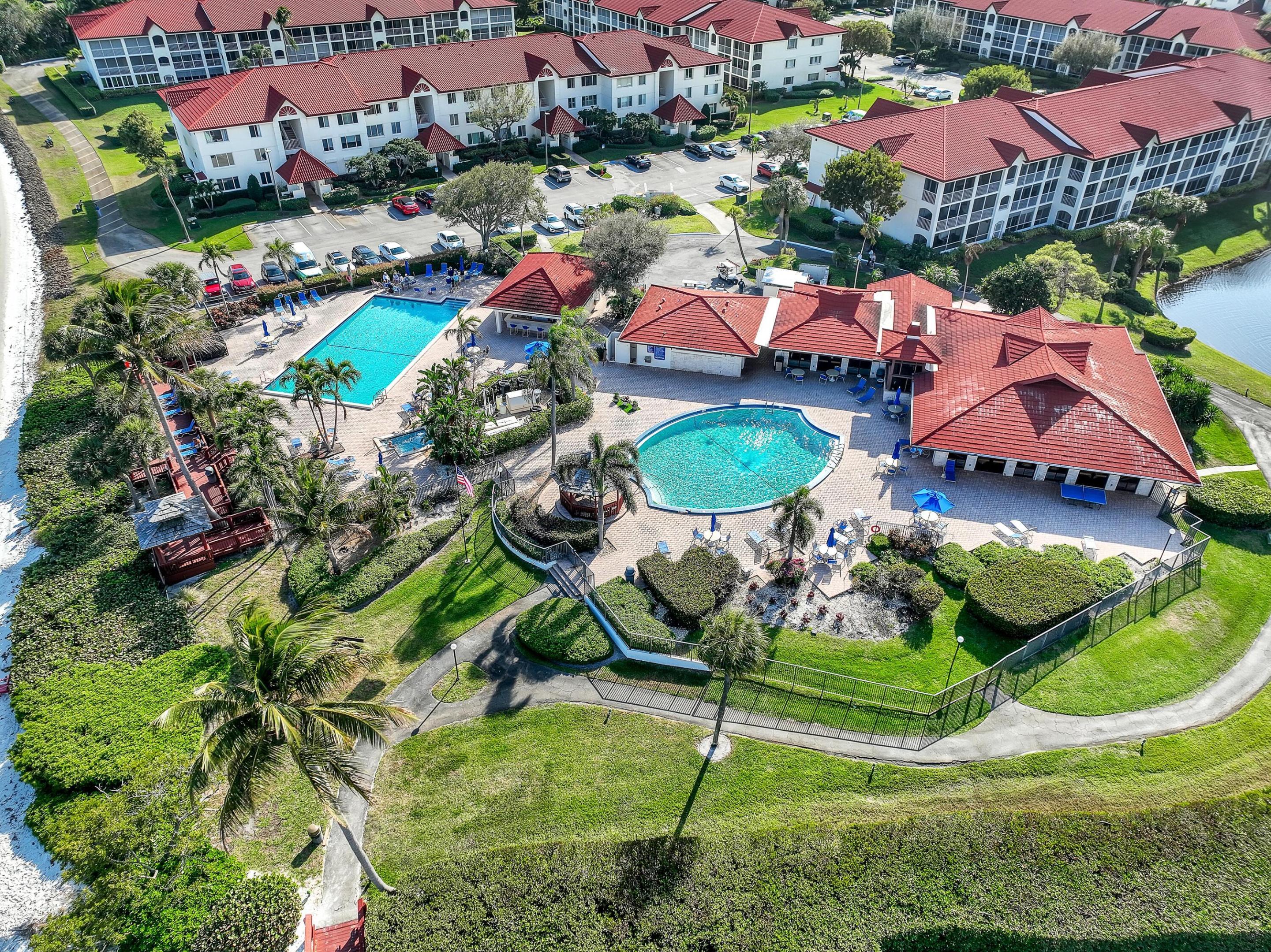 Image 2: Relax poolside with tropical landscaping, sparklin