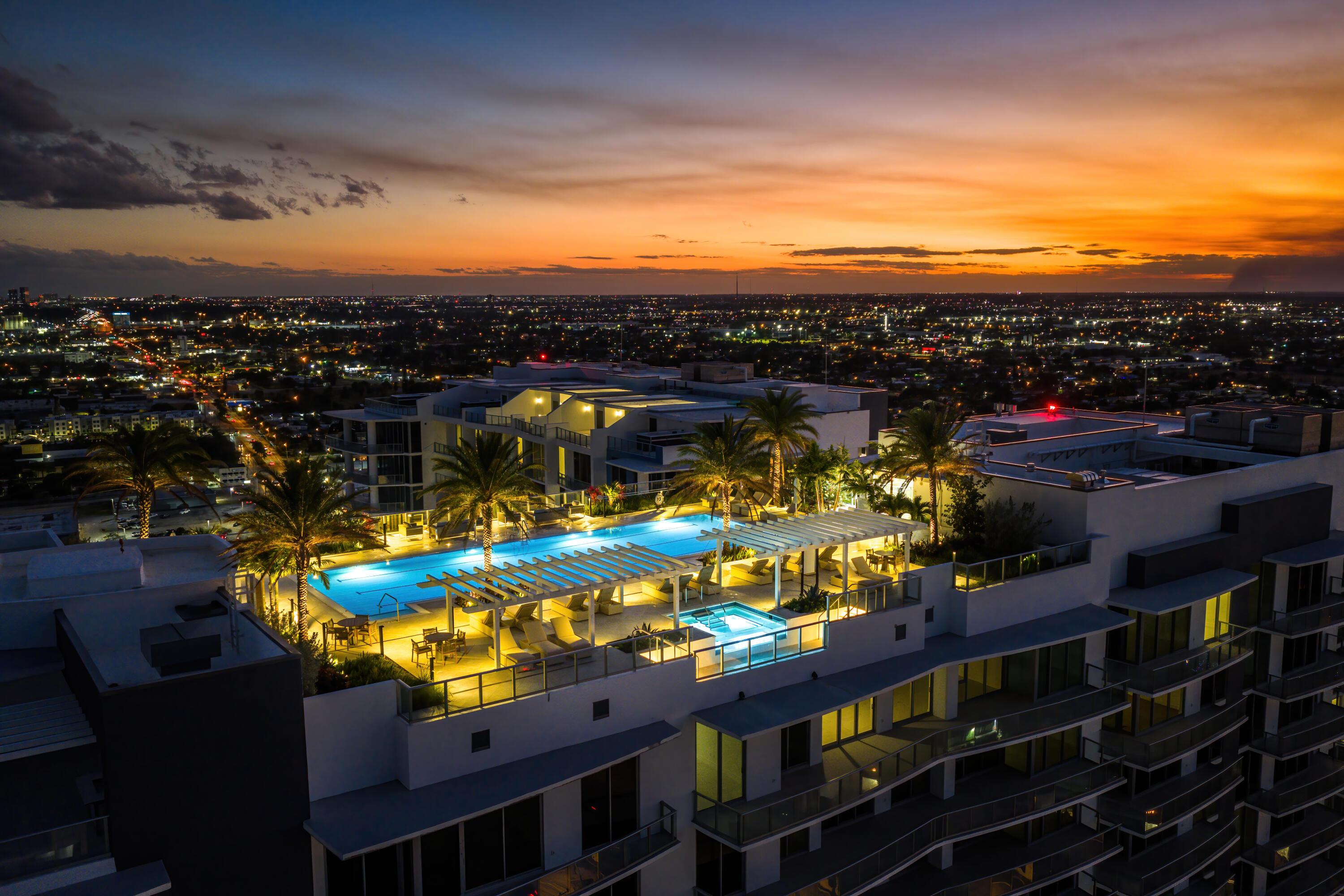 Image 1: NAUTILUS 220 ROOFTOP POOL SUNSET