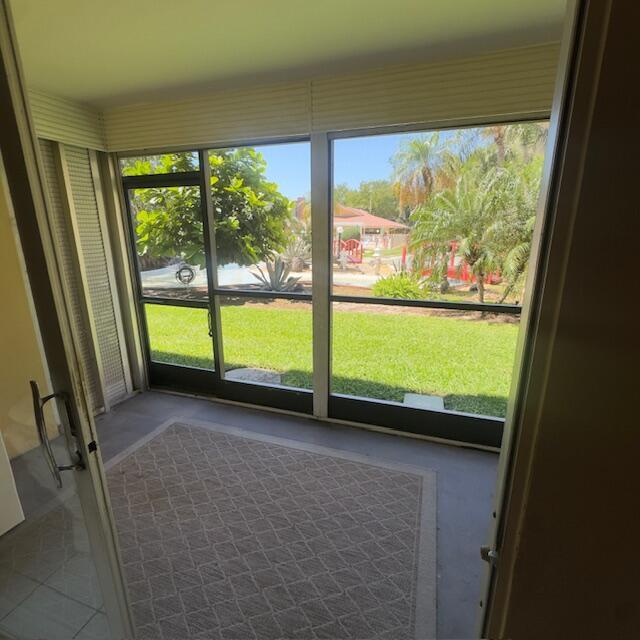 Image 2: Large screened patio just steps to the pool!