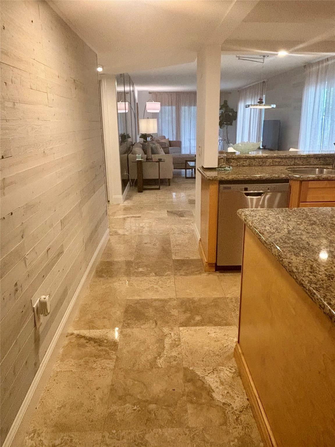 Image 2: Entry with Shiplap WallMarble floors