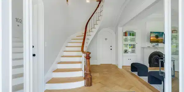Image 2: view from front foyer to staircase and r