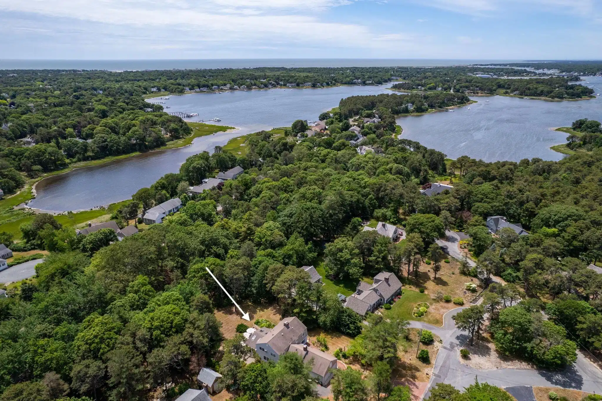 Image 1: Aerial view of house to water