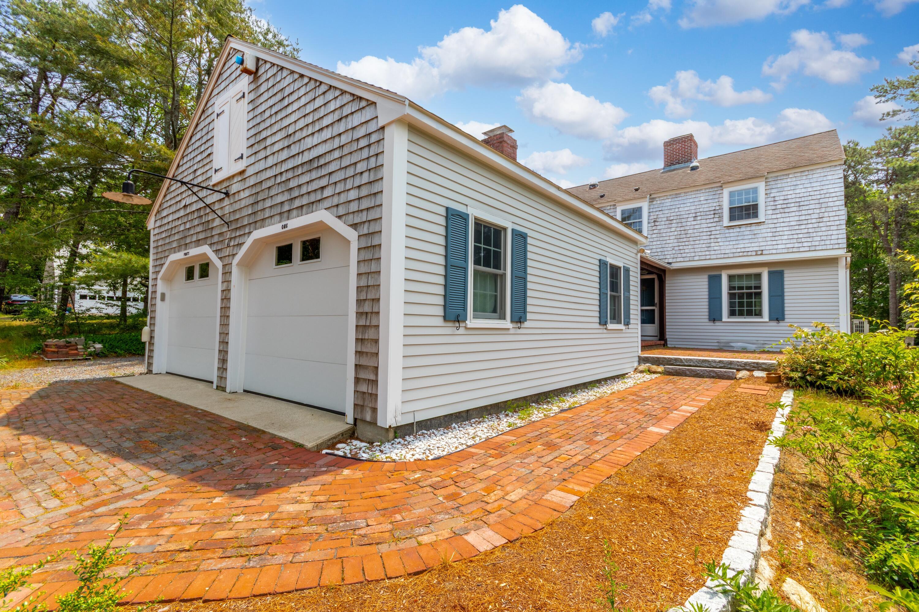 Image 3: Garage angle with brick walkway