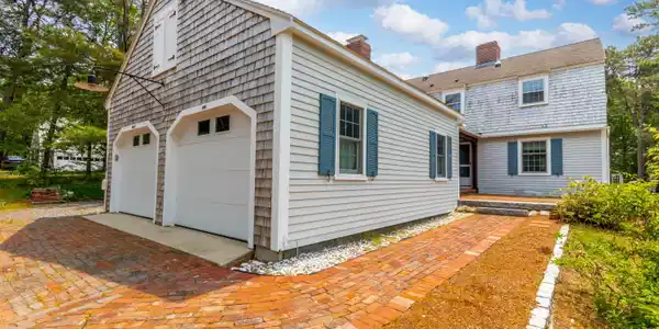 Image 3: Garage angle with brick walkway