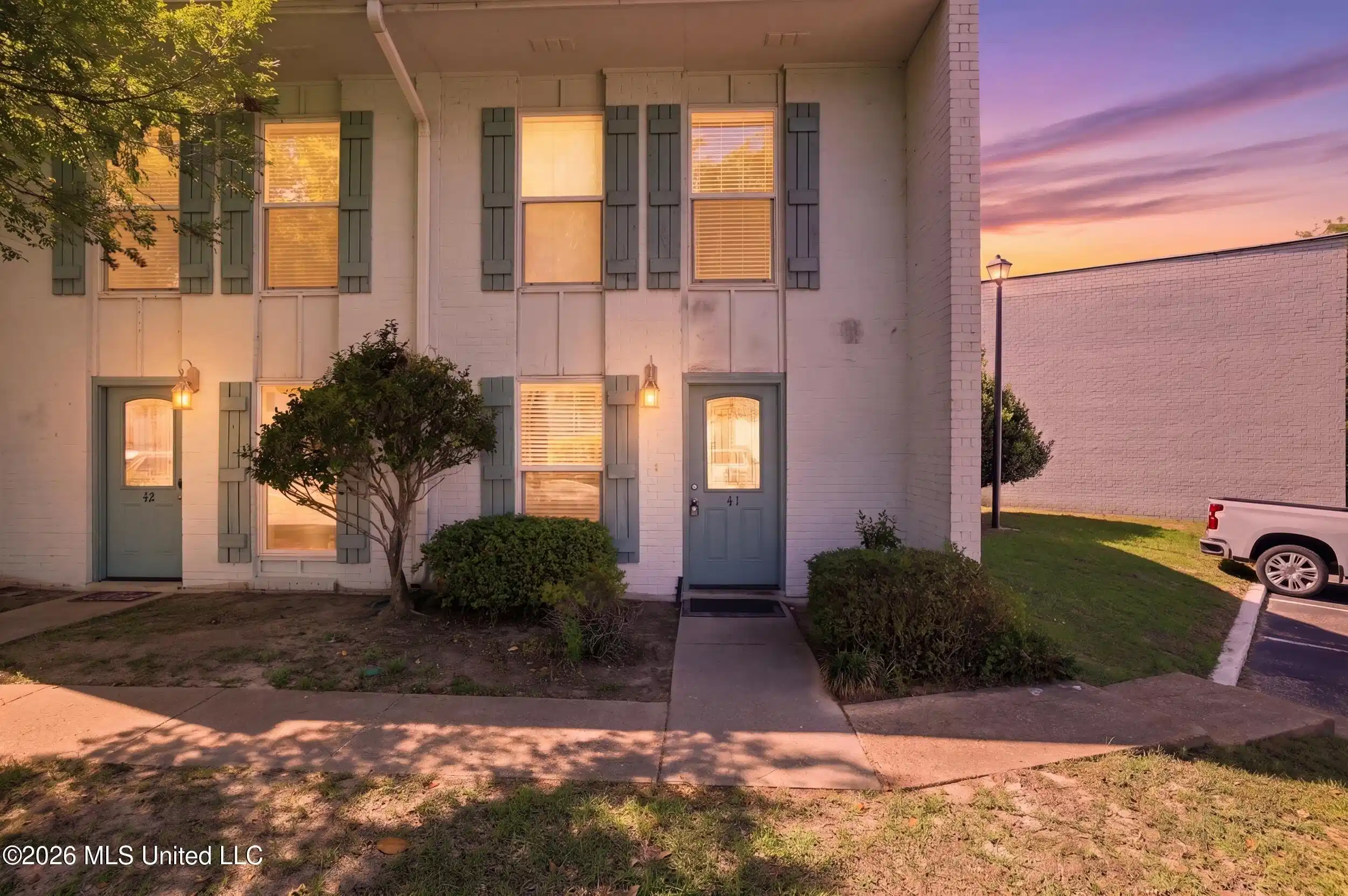 Image 1: EXTERIOR FRONT NIGHT VIEW