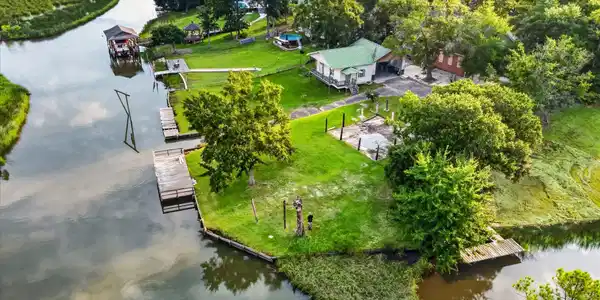 Image 2: Aerial of canal and backyard