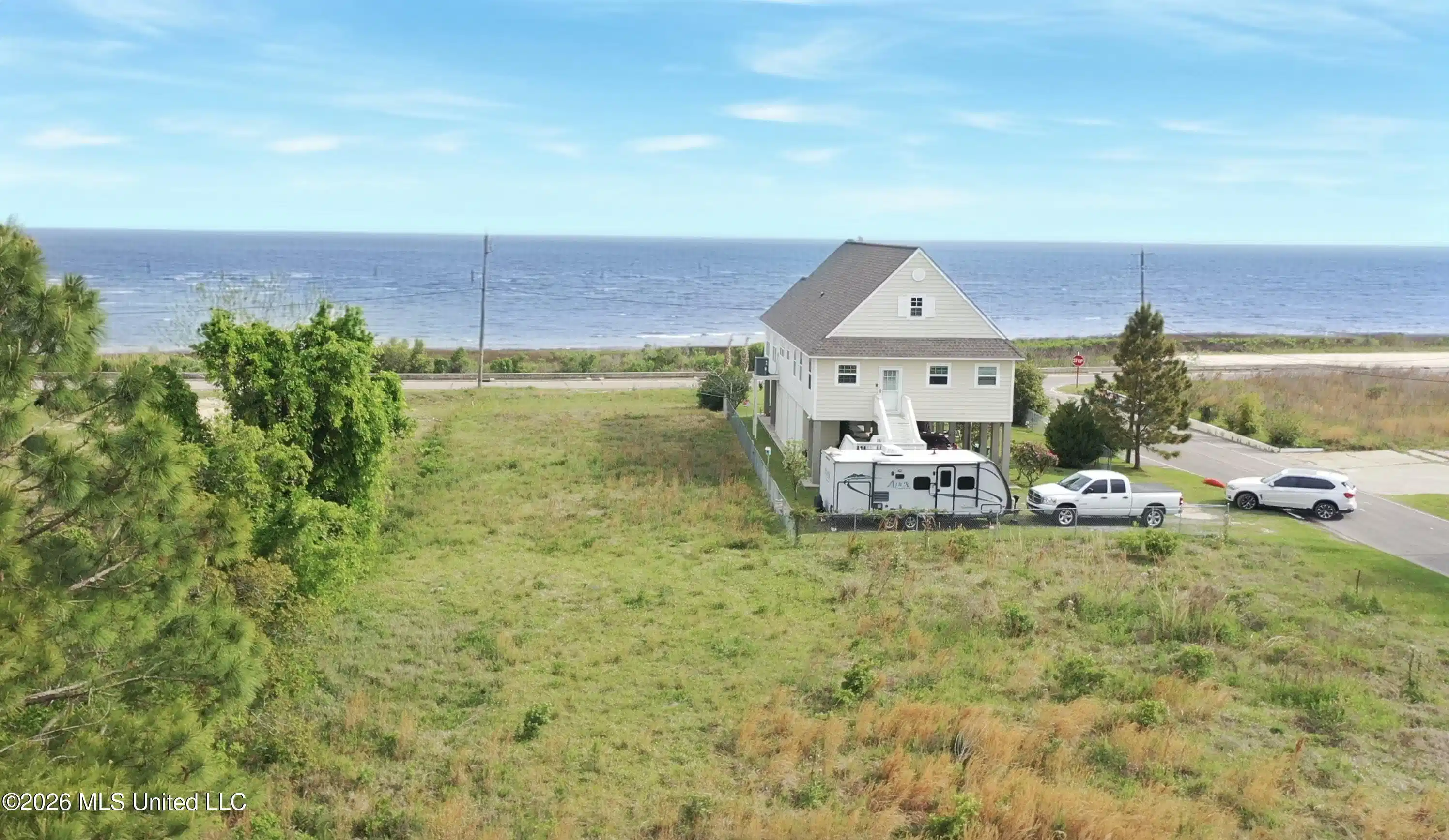 Image 1: 6236 S Beach total view from back of lot