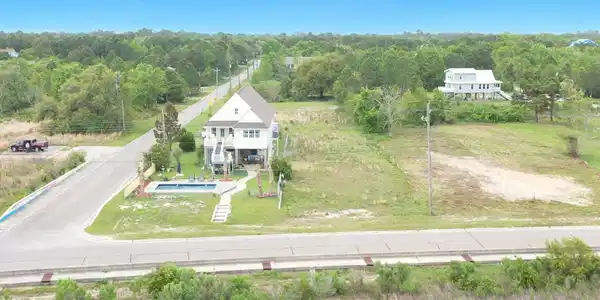 Image 3: 6236 S Beach from beachy area to the lot