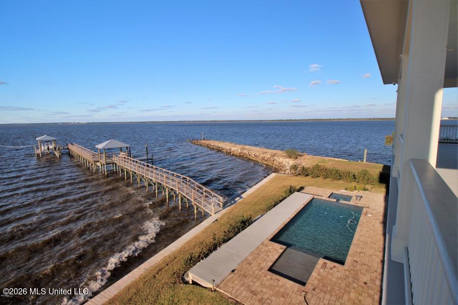 Image 2: View of Pool & Patio from Porch
