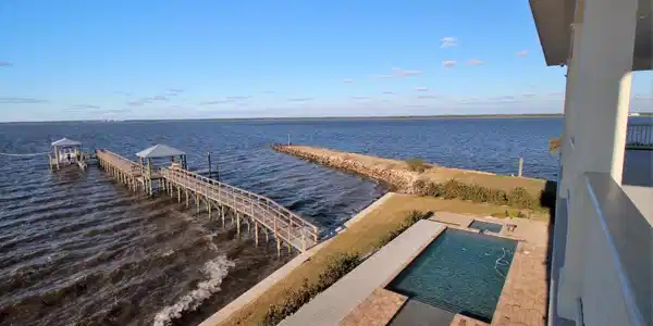 Image 2: View of Pool & Patio from Porch