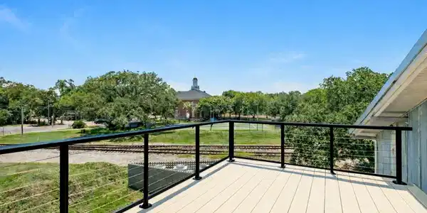 Image 4: Outdoor deck with view of railway