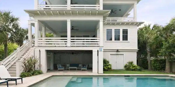 Image 4: Coastal backyard with pool and palms