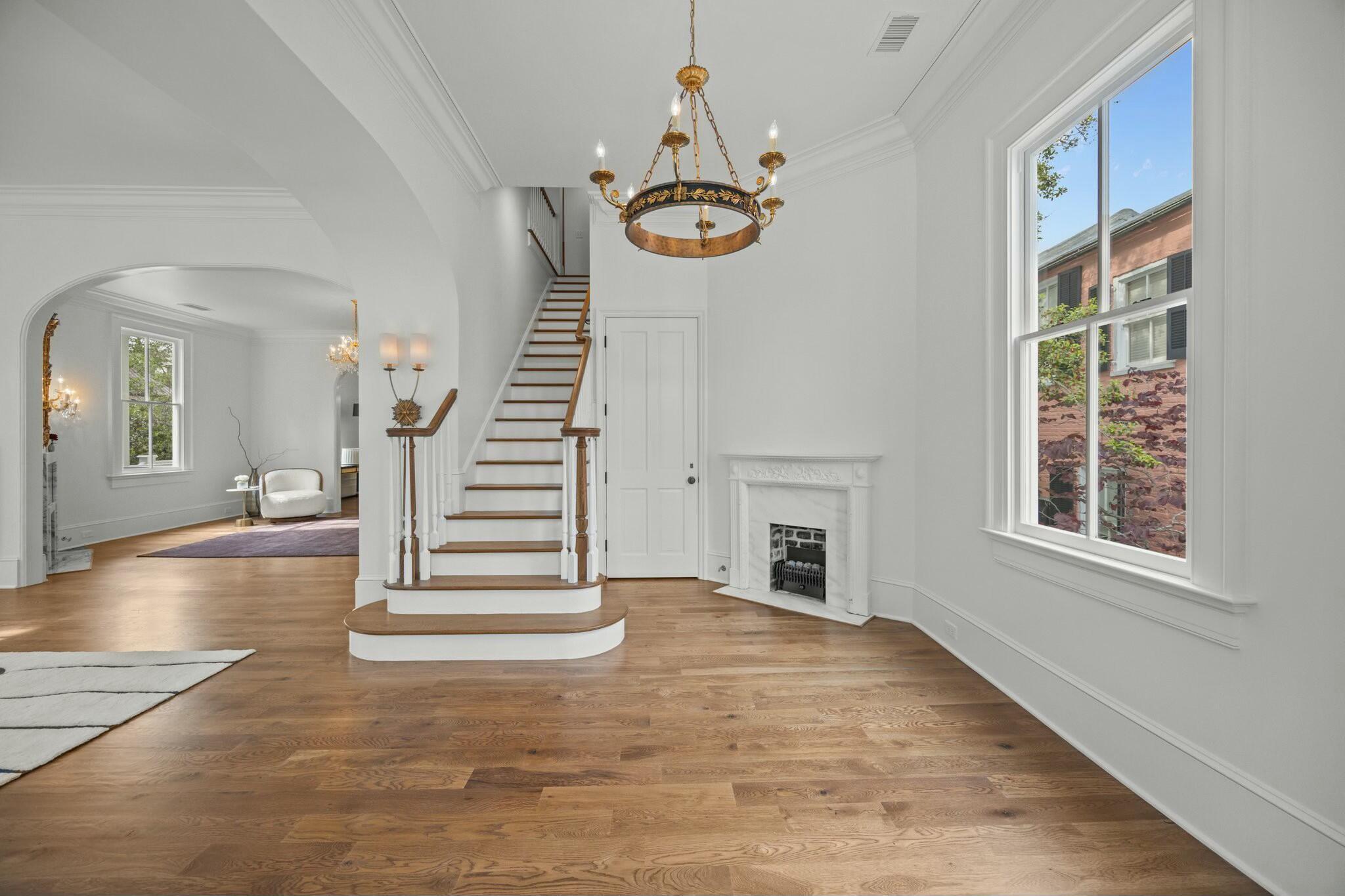 Image 4: gracious entrance foyer with fireplace