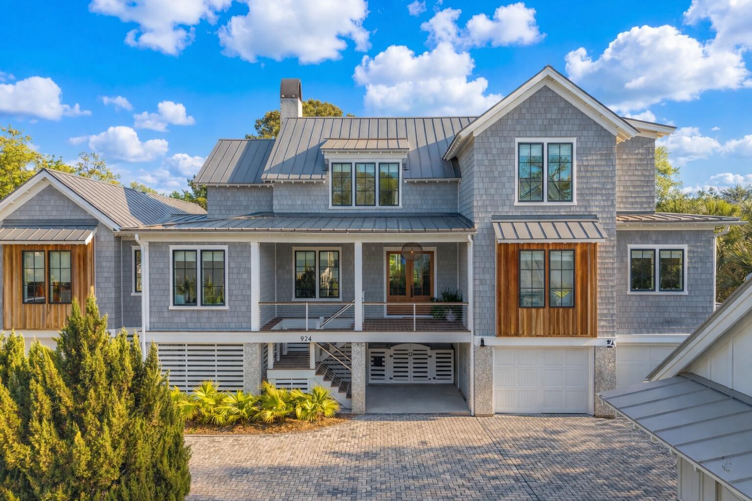 Image 1: Coastal style house with wooden accents