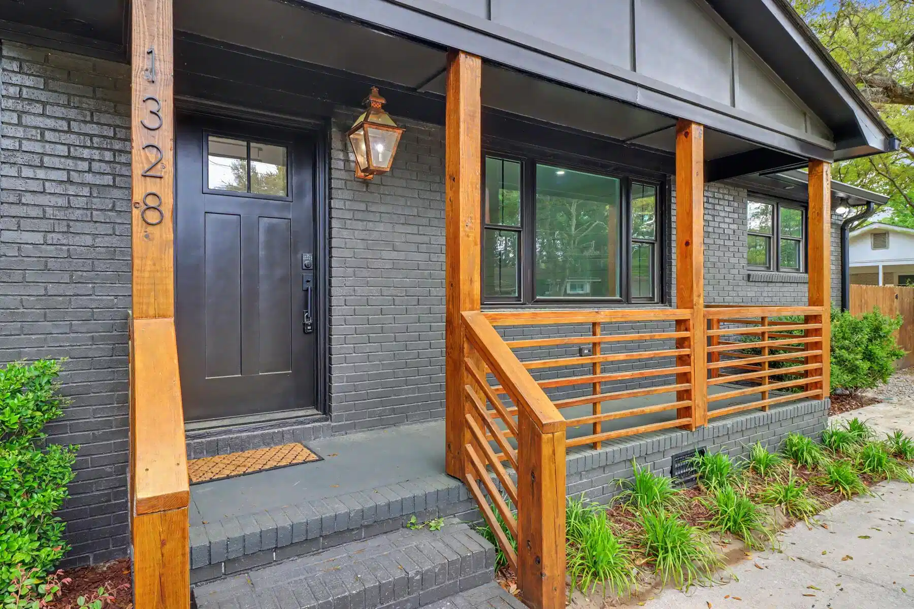 Image 1: Front Porch with Beautiful Woodwork