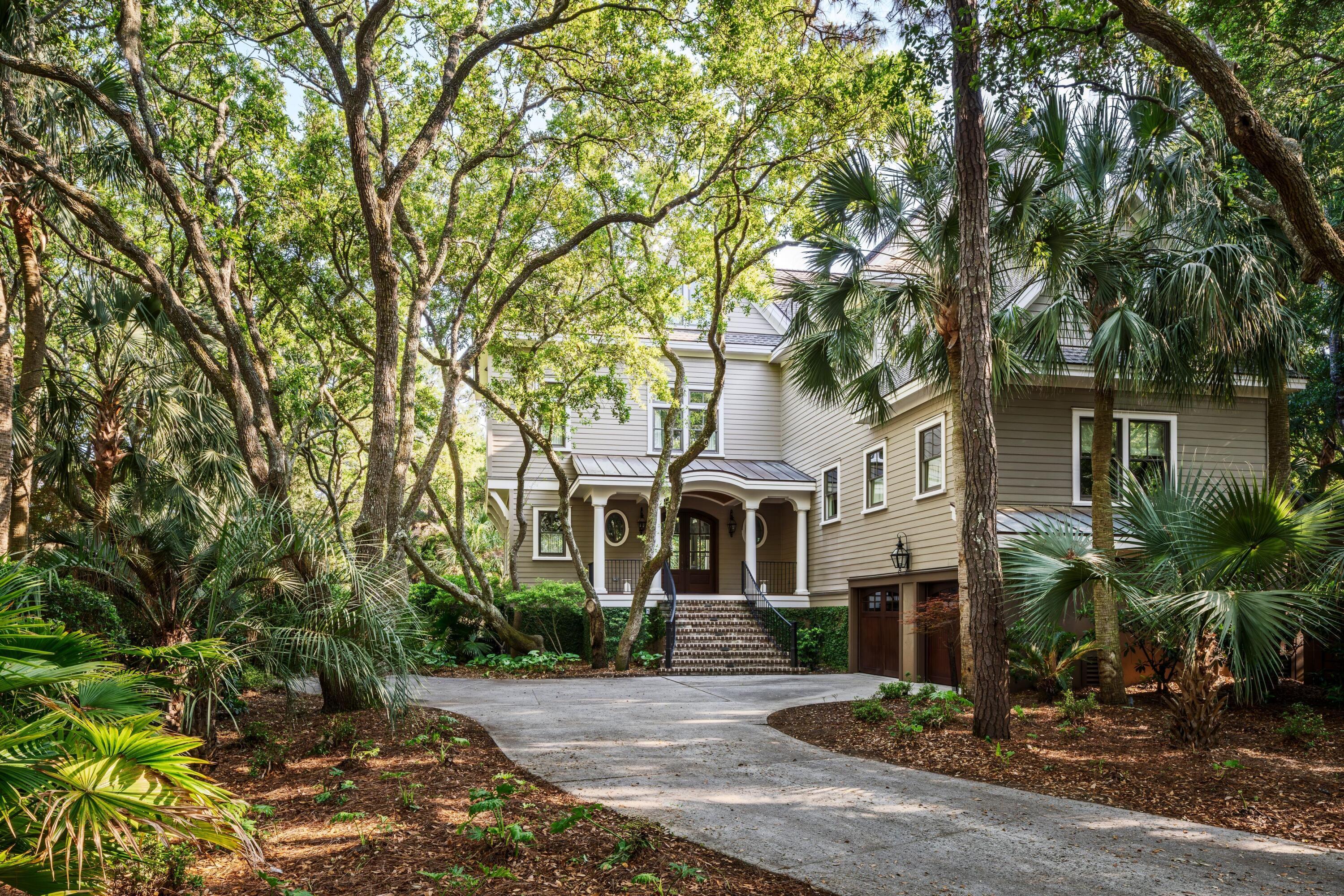 Image 2: 2. Front Exterior with Curved Driveway A