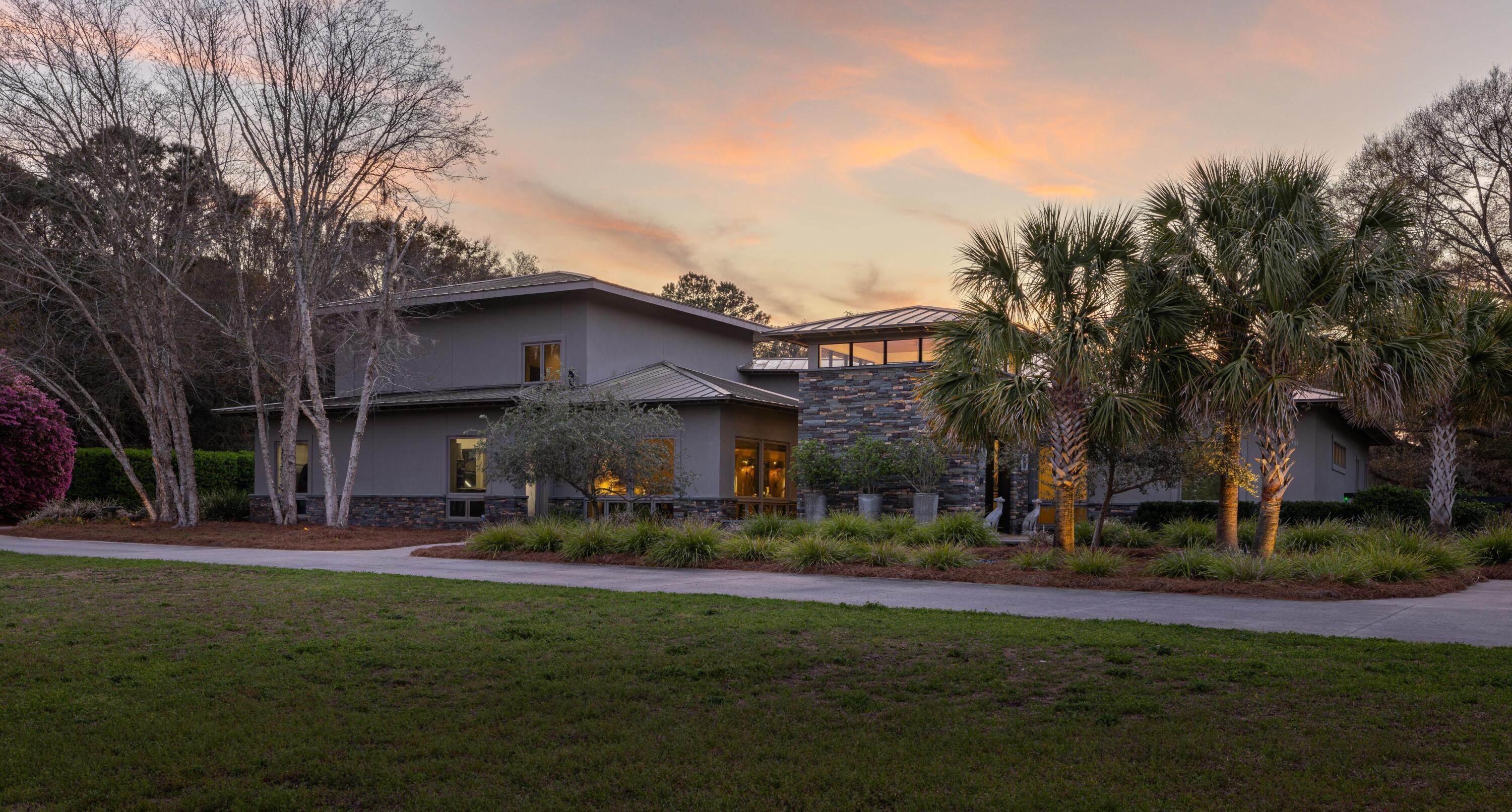 Image 4: Front view of home at sunset