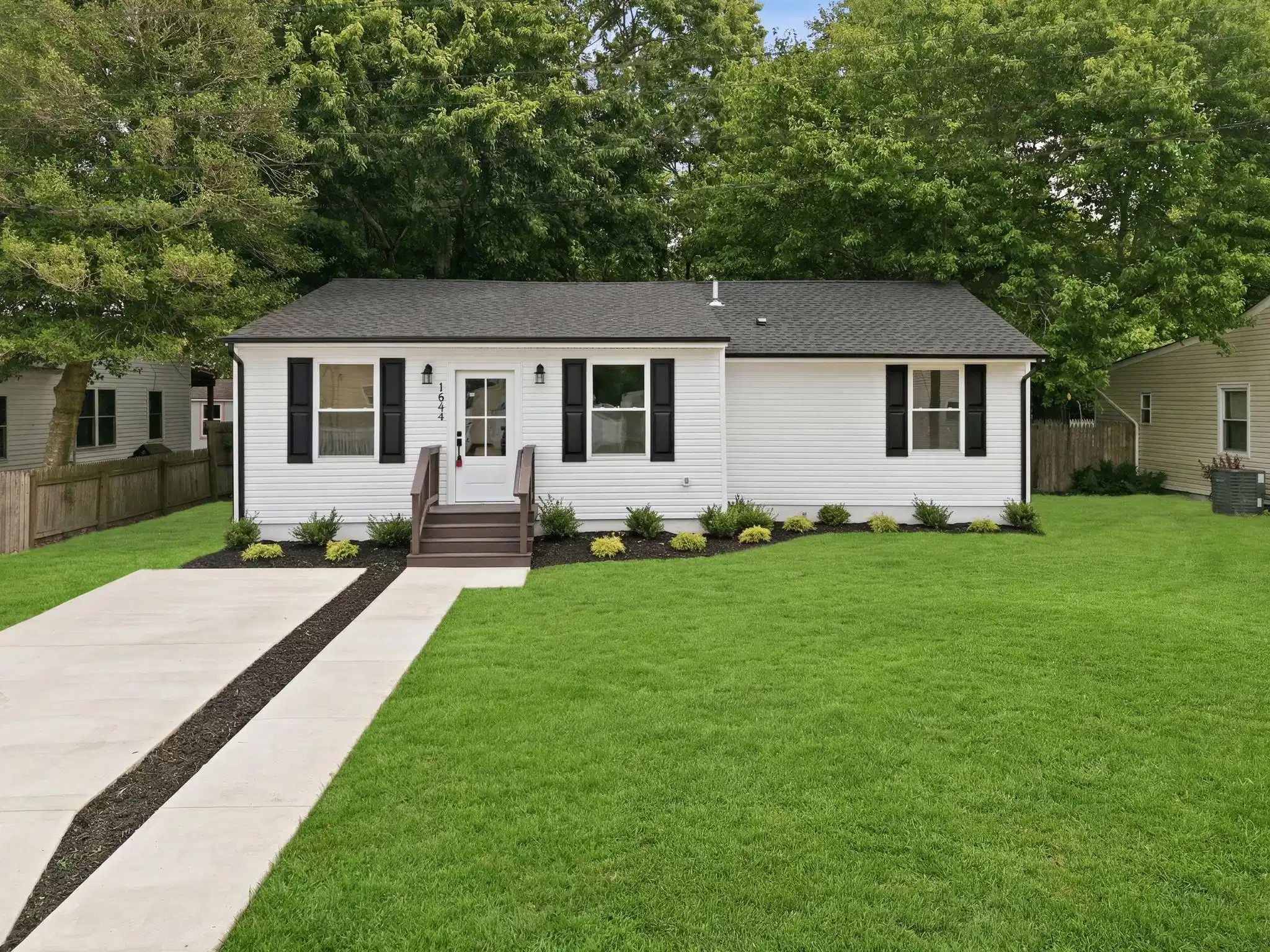 Image 0: Virtually staged landscaping