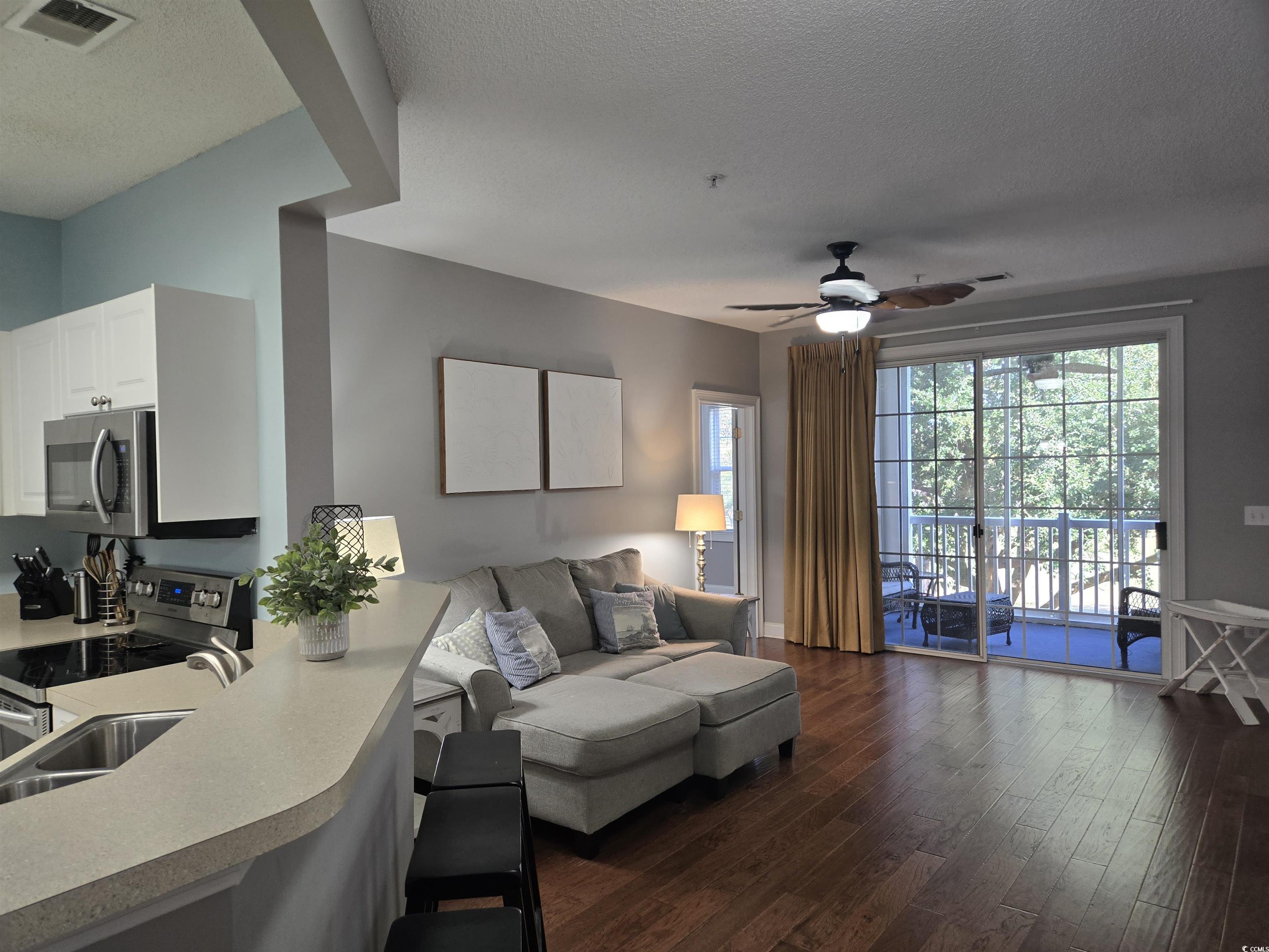 Image 4: Living area with dark wood-style floors, a texture Image 4: Living area with dark wood-style floors, a texture